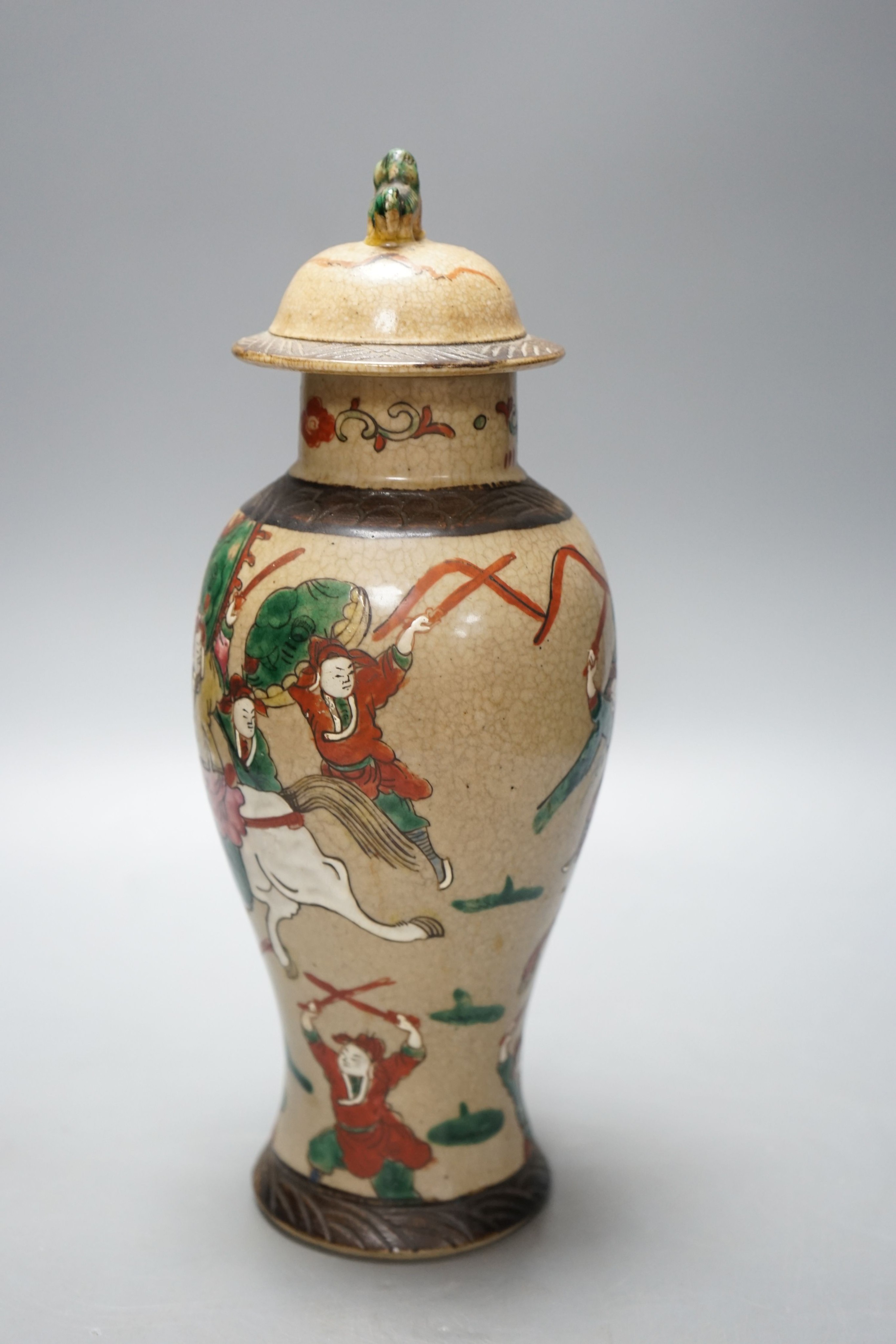 A late 19th century Chinese crackle glaze famille rose baluster vase and cover 30cm